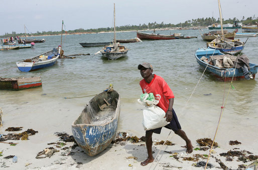 Fishing boats sit at the ready on the beach adjacent to the fish market, Monday, February 18, 2008 in the Tanzanian capitol of Dar es Salaam. White House photo by Chris Greenberg