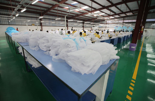 Workers at the A to Z Textile Mills in Arusha, Tanazia, stitch mosquito nets Monday, Feb. 18, 2008, where President George W. Bush and Mrs. Laura Bush toured the mill and visited with employees. White House photo by Shealah Craighead