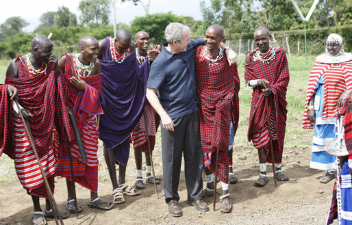 President George W. Bush thanks a Maasai warrior dance group for their performance in welcoming President Bush and Mrs. Laura Bush Monday, Feb. 18, 2008, to the Maasai Girls School in Arusha, Tanzania. White House photo by Eric Draper