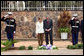 Flanked by saluting U.S. Marines President George W. Bush and Mrs. Laura Bush pause for a moment of silence after laying a wreath on a mass grave at the genocide memorial Tuesday, Feb. 19, 2008, at the Kigali Memorial Centre in Kigali, Rwanda. White House photo by Eric Draper