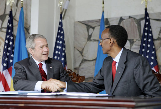 President George W. Bush and Rwanda President Paul Kagame shake hands after signing a Bilateral Investment Treaty Tuesday, Feb. 19, 2008, at the Presidency in Kigali, Rwanda. White House photo by Shealah Craighead