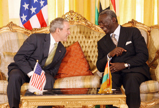 President George W. Bush speaks with Ghana President John Agyekum Kufuor during their meeting at Osu Castle, Wednesday, Feb. 20, 2008 in Accra, Ghana. White House photo by Eric Draper