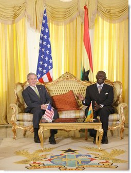 President George W. Bush and Ghana President John Agyekum Kufuor laugh together during their meeting at Osu Castle, Wednesday, Feb. 20, 2008 in Accra, Ghana. White House photo by Eric Draper