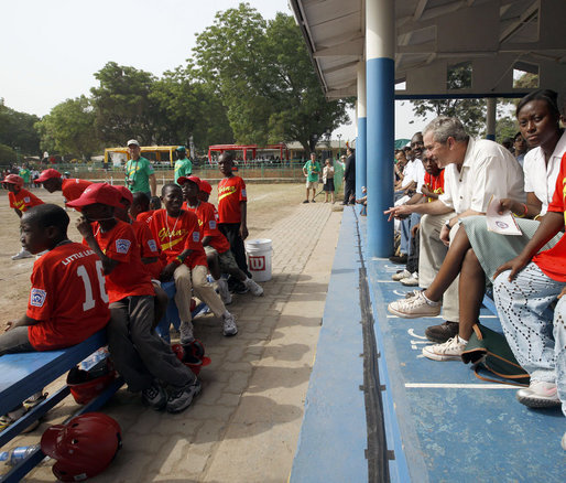 President George W. Bush talks with players during a tee ball game Wednesday, Feb. 20, 2008, at the Ghana International School in Accra, Ghana. White House photo by Eric Draper