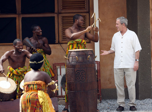 President George W. Bush speaks with musicians Wednesday, Feb. 20, 2008, during his visit to the International Trade Fair Center in Accra, Ghana. White House photo by Eric Draper