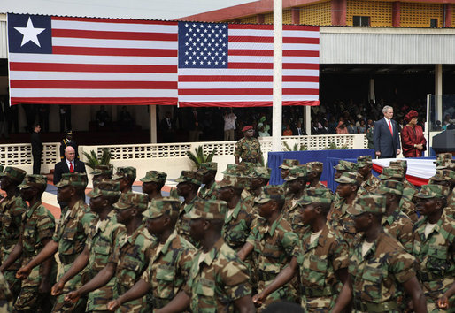 President George W. Bush and Liberian President Ellen Johnson Sirleaf review Liberian troops Thursday, Feb. 21, 2008, during President Bush’s visit to the Barclay Training Center in Monvoria, Liberia. White House photo by Shealah Craighead