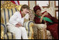 Mrs. Laura Bush listens to Liberian President Ellen Johnson-Sirleaf Thursday, February 21, 2008, in Monrovia, Liberia, during a gowning and investiture ceremony in honor of President Bush, Mrs. Bush and Secretary Condoleezza Rice. White House photo by Shealah Craighead