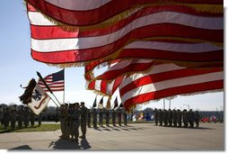 U.S. flags wave in the wind Tuesday, Feb. 26, 2008 during an Uncasing of the Colors Ceremony for the Third Corps at Fort Hood, Texas. White House photo by David Bohrer