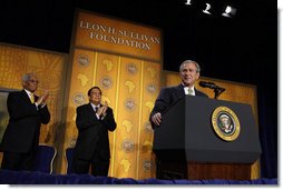 President George W. Bush receives applause during his remarks to The Leon H. Sullivan Foundation Tuesday, Feb. 26, 2008, in Washington, D.C. Joining the President on stage are Ambassador Andy Young, Chairman of the Board, Leon H. Sullivan, background center, and Ambassador Howard Jeter, president and CEO of The Leon H. Sullivan Foundation. White House photo by Eric Draper