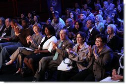 Mrs. Laura Bush applauds while listening to a panel discussion, flanked by NBA player Greg Oden, left, and student, Shantel Monk. Also seated with Mrs. Bush, at right, are Oregon Governor Theodore (Ted) Kulongoski and his, wife, Mrs. Mary Oberst. White House photo by Shealah Craighead