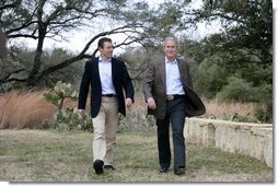 President George W. Bush and Prime Minister Anders Fogh Rasmussen of Denmark walk toward the cameras at the start of their press availability at The Bush Ranch in Crawford, Texas, Saturday, March 1, 2008, in Crawford, Texas. White House photo by Shealah Craighead