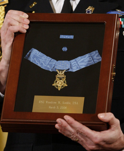 A White House military aide holds the Medal of Honor presented posthumously to U.S. Army Master Sgt. Woodrow Wilson Keeble by President George W. Bush, Monday, March 3, 2008 in the East Room of the White House. Master Sgt. Keeble, the first full-blooded Sioux Indian to receive the Medal of Honor, was recognized for his gallantry above and beyond the call of duty during military action in the Korean War. White House photo by Eric Draper