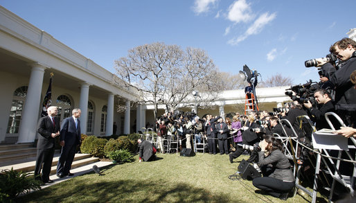 President George W. Bush and Arizona Senator John McCain stand in front of the media in the Rose Garden Wednesday, March 5, 2008. The President welcomed Senator McCain and his wife, Cindy, and offered his endorsement by saying, ". He's going to be the President who will bring determination to defeat an enemy, and a heart big enough to love those who hurt." White House photo by Eric Draper