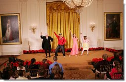 Mrs. Laura Bush, along with invited guests, watches a scene performance Friday, March 7, 2008 in the East Room of the White House, from the theater production of Chasing George Washington: A White House Adventure. The play is part of the Kennedy Center Performances for Young Audiences Series. White House photo by Joyce N. Boghosian