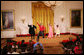 Mrs. Laura Bush, along with invited guests, watches a scene performance Friday, March 7, 2008 in the East Room of the White House, from the theater production of Chasing George Washington: A White House Adventure. The play is part of the Kennedy Center Performances for Young Audiences Series. White House photo by Joyce N. Boghosian