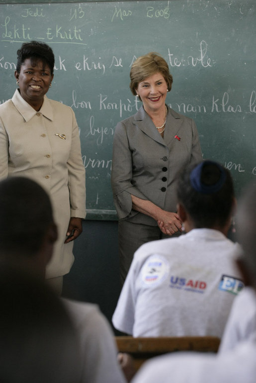 Mrs. Laura Bush visits students enrolled in the IDEJEN educational program at the College de St. Martin Tours Thursday, March 13, 2008, in Port-au-Prince, Haiti. Speaking to the program’s faculty and staff Mrs. Bush said, “Educating its young people is one of the best things a country can do to ensure its continued development.” White House photo by Shealah Craighead