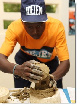 A student works on a sculpture Thursday, March 13, 2008, during Mrs. Laura Bush's visit to the IDEJEN educational program at the College de St. Martin Tours, in Port-au-Prine, Haiti. White House photo by Shealah Craighead