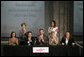 Mrs. Laura Bush applauds following the signing of the U.S.-Mexico Partnership for Breast Cancer Awareness and Research agreement between the Susan G. Komen for the Cure, MD Anderson Cancer Center, U.S. State Department, the Instituto Nacional de Cancerologia and Mexican Association Against Breast Cancer (Fundacion Cim*ab) Friday, March 14, 2008, at the Interactive Economics Museum in Mexico City. From left are Bertha Aguilar, Dr. Alejandro Mohar, U.S Ambassador to Mexico Antonio O. Garza, Jr., Hala Moddelmog, Margarita Zavala (standing), and Dr. Kendra Woods. White House photo by Shealah Craighead