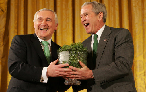 President George W. Bush breaks out in laughter as he's presented a bowl of shamrocks from Prime Minister Bertie Ahern of Ireland during a reception Monday, March 17, 2008, in celebration of St. Patrick's Day. White House photo by Joyce N. Boghosian