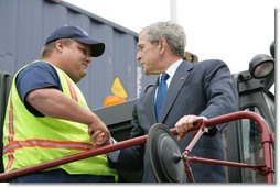 President George W. Bush shakes hands with Frederick Bishop, a stacker operator for Coastal Maritime Stevedoring, LLC, during a tour Tuesday, March 18, 2008, of the Blount Island Marine Terminal in Jacksonville, Fla. The President toured the facility while in the state to deliver remarks on trade policy. White House photo by Chris Greenberg