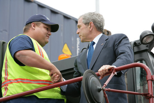 President George W. Bush shakes hands with Frederick Bishop, a stacker operator for Coastal Maritime Stevedoring, LLC, during a tour Tuesday, March 18, 2008, of the Blount Island Marine Terminal in Jacksonville, Fla. The President toured the facility while in the state to deliver remarks on trade policy. White House photo by Chris Greenberg