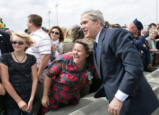 President George W. Bush poses for a photo with a port worker at the Blount Island Marine Terminal Tuesday, March 18, 2008, in Jacksonville, Fla. White House photo by Chris Greenberg