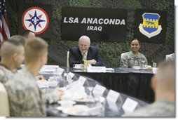 Vice President Dick Cheney talks with U.S. troops during breakfast Tuesday, March 18, 2008, at Balad Air Base, Iraq. Following a day of meetings in Baghdad the Vice President and Mrs. Cheney were overnight guests at the base.  White House photo by David Bohrer