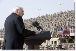 Vice President Dick Cheney delivers remarks Tuesday, March 18, 2008 to U.S. troops during a rally at Balad Air Base, Iraq. "During this deployment, ladies and gentlemen, you've seen incredible progress on the ground in Iraq -- not just as witnesses, but as participants," said the Vice President, adding, "The President and I, and your fellow citizens, want nothing more than have you and all of your comrades return home safely at the end of this tour of duty. We're going to do everything we can to make that happen." White House photo by David Bohrer