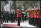 Vice President Dick Cheney is joined by President Hamid Karzai of Afghanistan for the playing of the national anthem of the United States Thursday, March 20, 2008, during an arrival ceremony at Gul Khana Palace in Kabul. While in Afghanistan the Vice President held meetings with President Karzai and visited Bagram Air Base for a classified briefing and dinner with U.S. troops. White House photo by David Bohrer