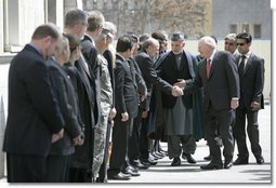 Vice President Dick Cheney is escorted by President of Afghanistan Hamid Karzai as he greets Afghan officials upon arrival to Gul Khana Palace in Kabul Thursday, March 20, 2008. The Vice President met with President Karzai and Afghan officials to reaffirm America's commitment to Afghanistan and discuss ways the U.S. would continue to help Afghanistan become a more prosperous and stable nation. White House photo by David Bohrer