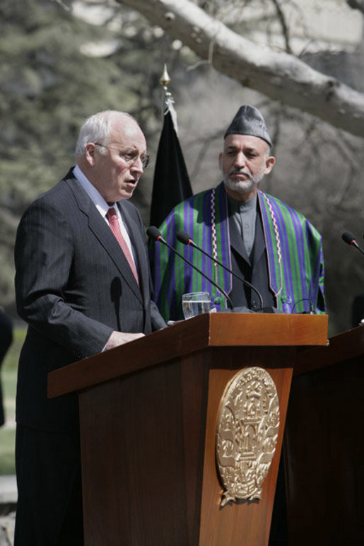 With President Hamid Karzai of Afghanistan looking on, Vice President Dick Cheney delivers a statement to the press Thursday, March 20, 2008 on the grounds of Gul Khana Palace in Kabul. "During the last six years, the people of Afghanistan have made a bold and confident journey, throwing off the burden of tyranny, winning your freedom and reclaiming your future," said the Vice President, adding, "The United States of America has proudly walked with you on this journey, and we walk with you still." White House photo by David Bohrer