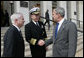 President George W. Bush shakes hands with Joint Chiefs of Staff Chairman Admiral Michael Mullen, and accompanied by U.S. Defense Secretary Robert Gates, as he departs the Pentagon Wednesday, March 26, 2008, following a briefing at the U.S. Department of Defense in Arlington, Va. White House photo by Chris Greenberg