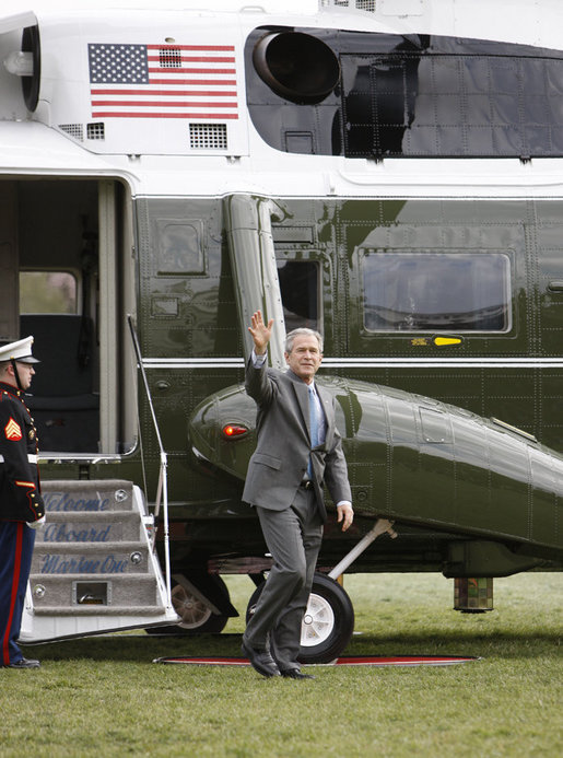 President George W. Bush waves to Mrs. Laura Bush and her Midland High School graduating classmates of 1964 welcoming his return to the South Lawn of the White House Friday afternoon, March 28, 2008. Mrs. Bush is hosting her classmates for their class reunion at the White House. White House photo by Eric Draper