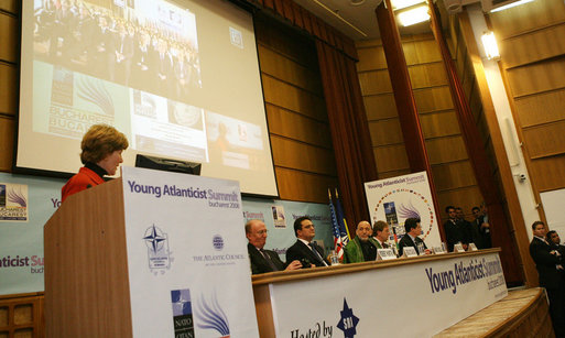 Mrs. Laura Bush acknowledges Afghanistan’s President Hamid Karzai and his country’s democratic successes during their appearance at the Bucharest headquarters of the Romanian Intelligence Service Thursday, April 3, 2008, for a video teleconference with students from Kabul University as part of the Young Atlanticist Summit. White House photo by Shealah Craighead