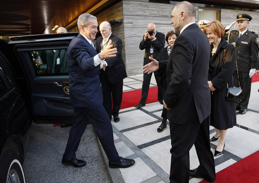 President George W. Bush reaches out for the hand of President Stjepan Mesic of Croatia upon arrival at the official welcoming ceremonies Friday, April 4, 2008, at the Office of the President in Zagreb. White House photo by Eric Draper