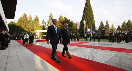 President George W. Bush and President Stjepan Mesic of Croatia review troops Friday, April 4, 2008, during welcoming ceremonies in Zagreb for the President and Mrs. Bush. White House photo by Eric Draper