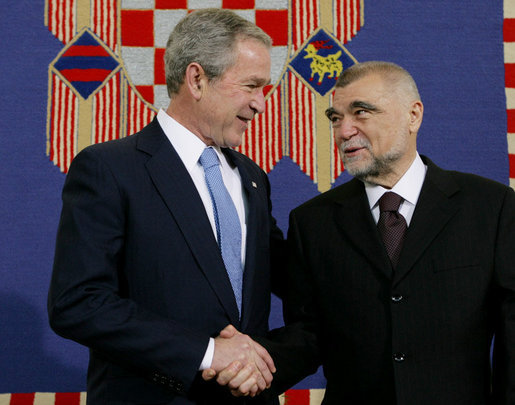 President George W. Bush shakes hands with President Stjepan Mesic of Croatia during arrival ceremonies in honor of the President and Mrs. Bush Friday, April 4, 2008, at the Office of the President in Zagreb. White House photo by Chris Greenberg