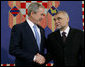 President George W. Bush shakes hands with President Stjepan Mesic of Croatia during arrival ceremonies in honor of the President and Mrs. Bush Friday, April 4, 2008, at the Office of the President in Zagreb. White House photo by Chris Greenberg