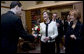 Mrs. Laura Bush accepts a bouquet of flowers as she arrives for tea Friday, April 4, 2008, with Mrs. Milka Mesic, right, spouse of Croatian President Stjepan Mesic, at the Office of the President in Zagreb. White House photo by Shealah Craighead