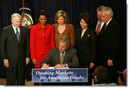 President George W. Bush signs transmittal papers for the Colombian Free Trade Agreement Monday, April 7, 2008, in Dwight D. Eisenhower Executive Office Building. President Bush is joined by, left to right, Secretary Bob Gates, Department of Defense; Secretary Condoleezza Rice, Department of State; Ambassador Susan Schwab, United States Trade Representative; Secretary Elaine Chao, Department of Labor; Director John Walters, Office of National Drug Control Policy; and Secretary Ed Schafer, Department of Agriculture. White House photo by Joyce N. Boghosian