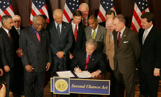 President George W. Bush signs H.R. 1593, the Second Chance Act of 2007, during a ceremony Wednesday, April 9, 2008, at the Eisenhower Executive Office Building. The Second Chance Act aims to reduce prison populations and corrections costs by reducing the recidivism rate. The bill provides Federal funding to develop programs dealing with job training, substance abuse, and family stability, as well as for employers who hire former prisoners. White House photo by Joyce N. Boghosian