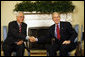 President George W. Bush shakes hands with Singapore's Senior Minister Goh Chok Tong Wednesday, April 9, 2008, in the Oval Office at the White House. White House photo by Eric Draper