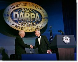 Vice President Dick Cheney is welcomed by Deputy Secretary of Defense Gordon England Thursday, April 10, 2008, to deliver the keynote speech at the Defense Advanced Research Projects Agency 50th anniversary celebration in Washington, D.C. The Vice President congratulated DARPA on its history of achieving significant technological breakthroughs to aid in U.S. defense and national security. White House photo by David Bohrer