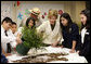 Mrs. Laura Bush works with students from the Williams Preparatory School in Dallas, Thursday, April 10, 2008, during planting events at the First Bloom program to help encourage youth to get involved with conserving America's National Parks. White House photo by Shealah Craighead