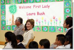 Mrs. Laura Bush sits before a banner welcoming her to the Williams Preparatory School in Dallas, Thursday, April 10, 2008, where she participated in the First Bloom program activities to help encourage youth to get involved with conserving America's National Parks. The First Bloom program is being introduced in five cities across the nation to give children a sense of pride in our natural resources and to be good stewarts of America's diverse environment. White House photo by Shealah Craighead