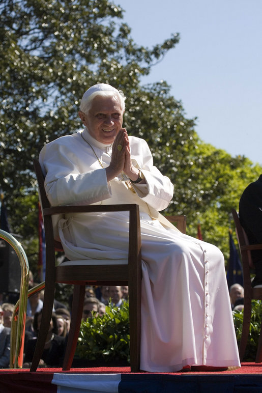 Pope Benedict XVI acknowledges guests Wednesday, April 16, 2008, during the arrival ceremony for the Pope on the South Lawn of the White House. Said Pope Benedict XVI during the ceremony, "Mr. President, dear friends, as I begin my visit to the United States, I express once more my gratitude for your invitation, my joy to be in your midst, and my fervent prayers that Almighty God will confirm this nation and its people in the ways of justice, prosperity and peace." White House photo by David Bohrer