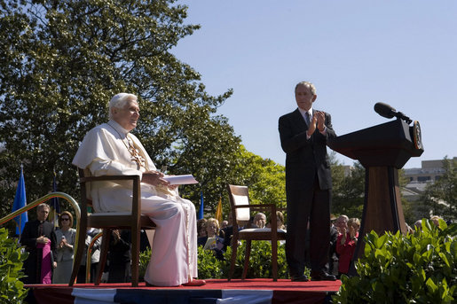 President George W. Bush applauds Pope Benedict XVI, Wednesday, April 16, 2008, during an arrival ceremony for the Pope on the South Lawn. During his remarks the Pope encouraged the American people saying, "I am confident that the American people will find in their religious beliefs a precious source of insight and an inspiration to pursue reasoned, responsible and respectful dialogue in the effort to build a more human and free society." White House photo by David Bohrer