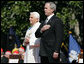 President George W. Bush and Pope Benedict XVI stand together during the playing of the National Anthem at the Pope’s welcoming ceremony on the South Lawn of the White House Wednesday, April 16, 2008. White House photo by Shealah Craighead