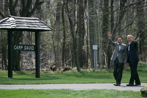 President George W. Bush and South Korean President Lee Myung-bak wave to the press after concluding a joint press availability Saturday, April 19, 2008, at the Presidential retreat at Camp David, Md. White House photo by Shealah Craighead