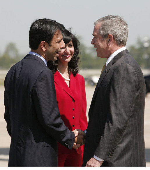 President George W. Bush is greeted by Louisiana Governor Bobby Jindal and his wife, Supriya Jolly Jindal, on his arrival to Louis Armstrong New Orleans International Airport Monday, April 21, 2008, where President Bush will attend the 2008 North American Leaders’ Summit. White House photo by Joyce N. Boghosian